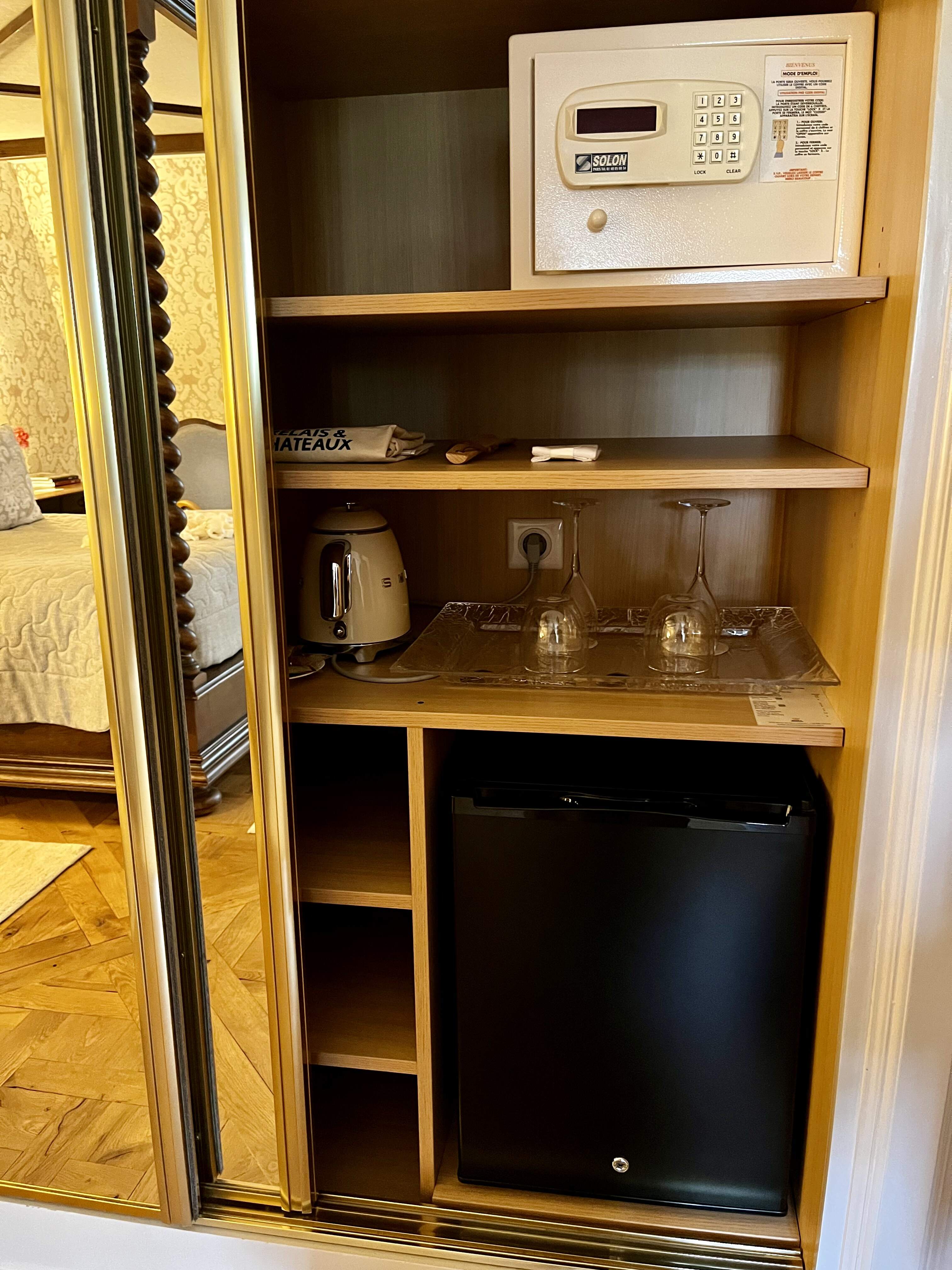 room minibar and safe at Château de la Treyne castle hotel